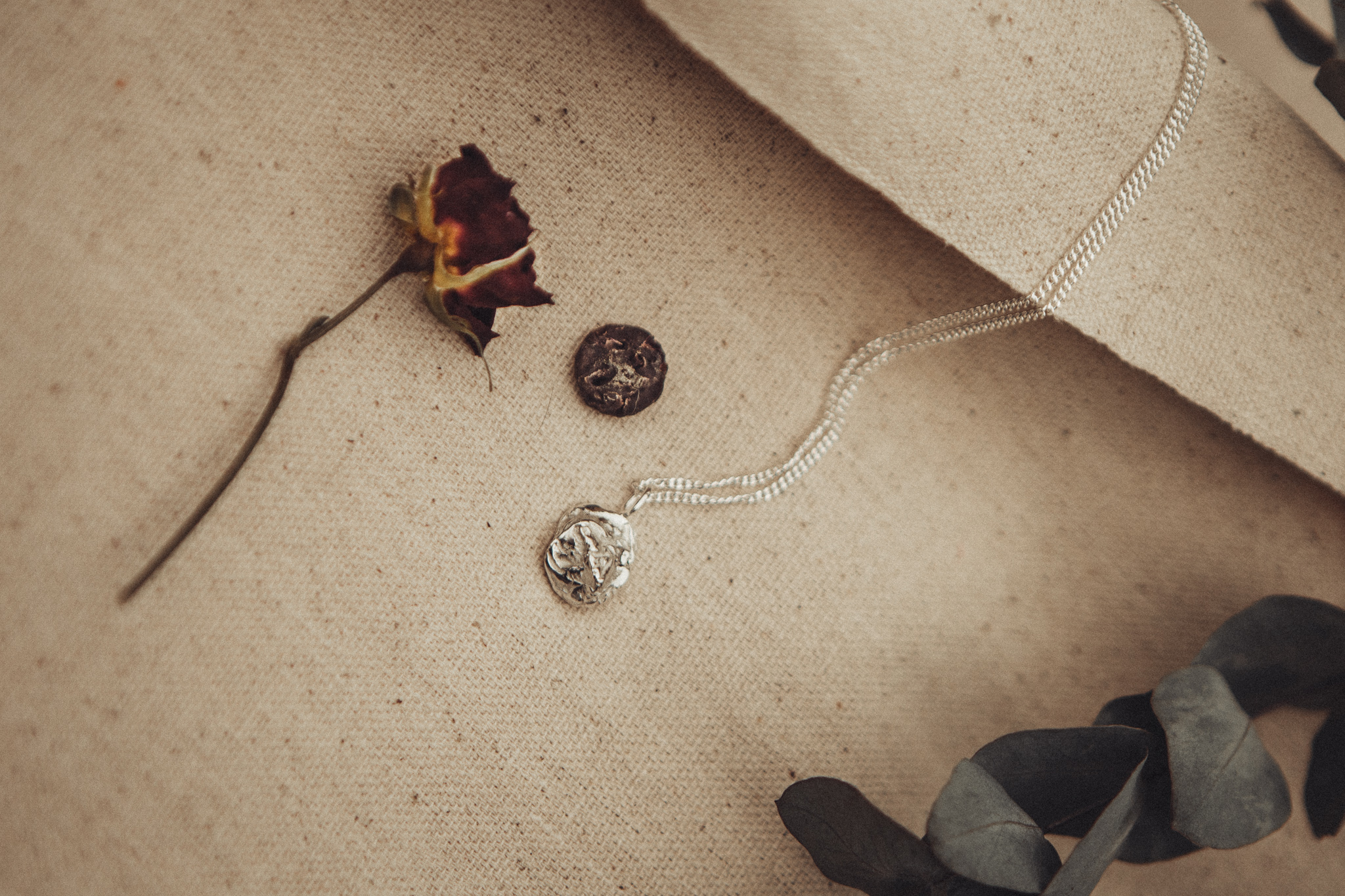 A Rose, the impression of rose and the finished silver pendant