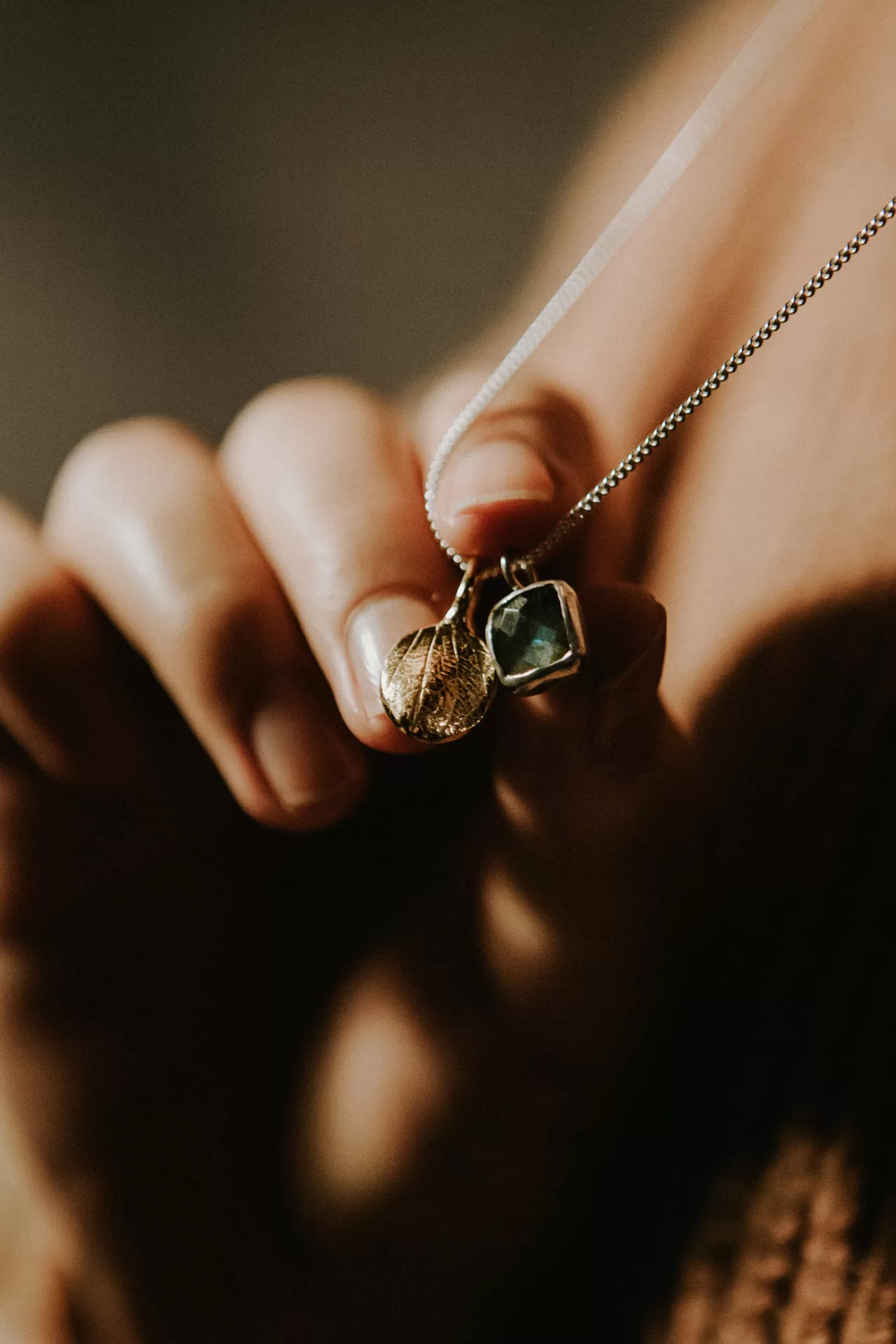 Bespoke COveted neckalce with palm impression and sapphire gem