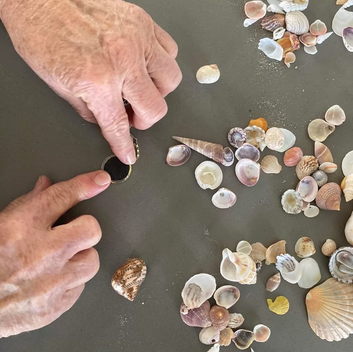 mature hands making an impression with coveted jewellery impression wax